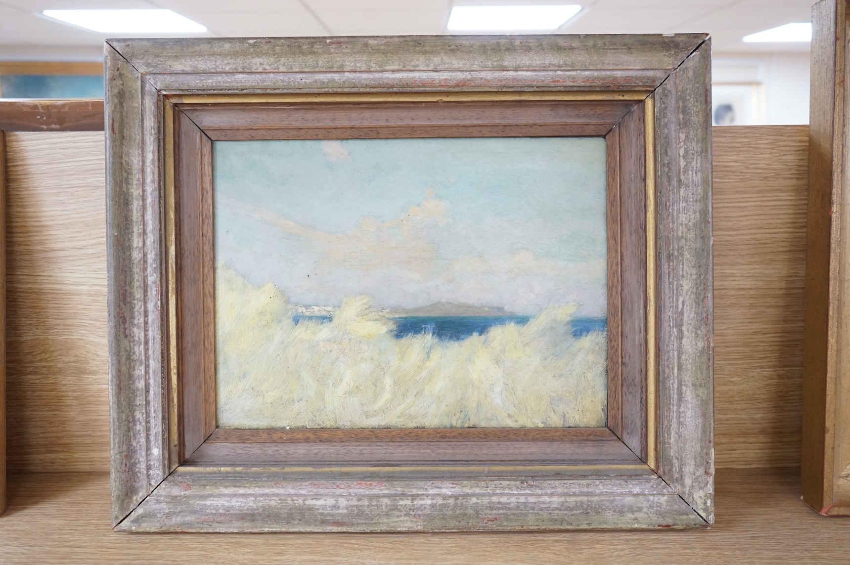 Attributed to Frank Emanuel (1865-1948), oil on board, Coastal view, unsigned, details verso, board stamped ‘James Latham, St. Ives Cornwall’ verso, 26 x 34cm. Condition - would benefit from a clean